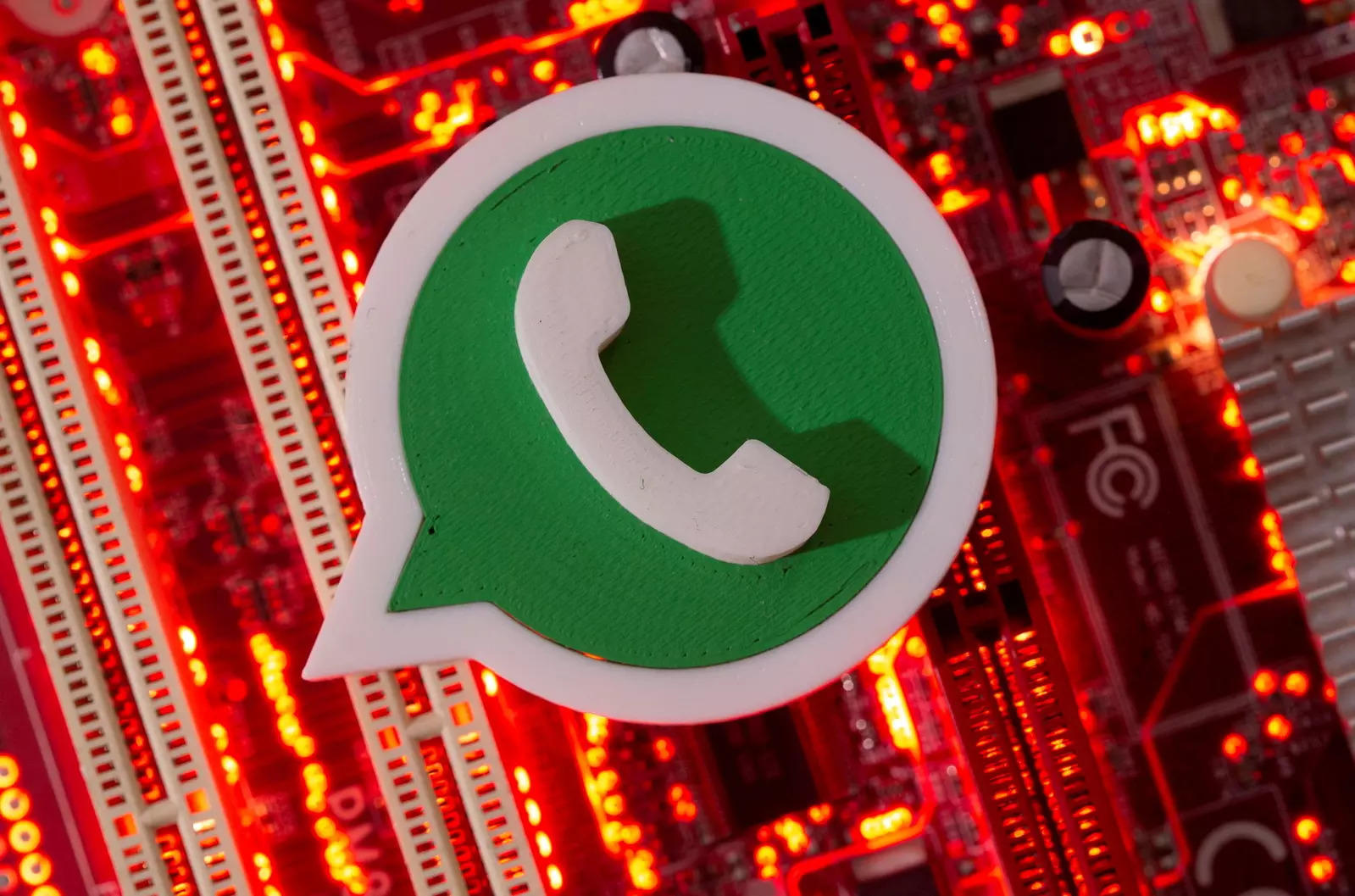 FILE PHOTO: FILE PHOTO: A 3D printed Whatsapp logo is placed on a computer motherboard